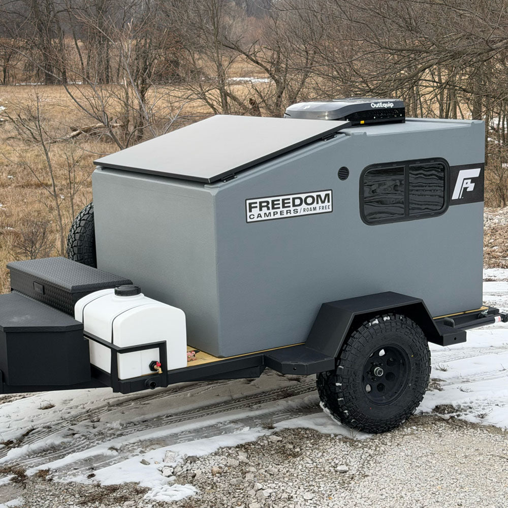 12V air conditioner mounted on top of the Freedom Camper. AC unit provides cooling and heating.