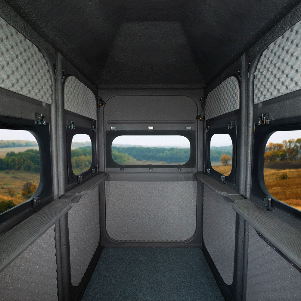 Interior view of Redneck Blind's 4x6 Twin Hunter blind overlooking a field.
