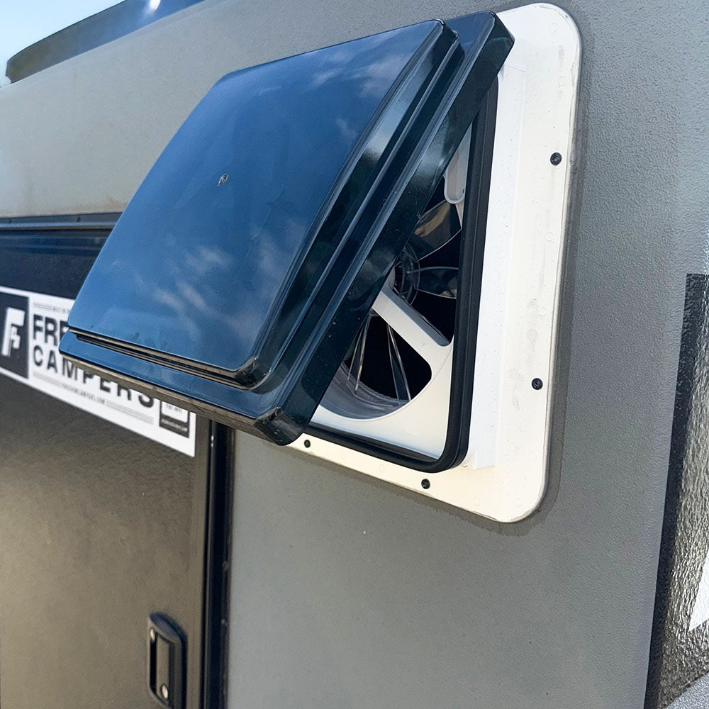 Camper fan installed next to the entry door of a Freedom Camper
