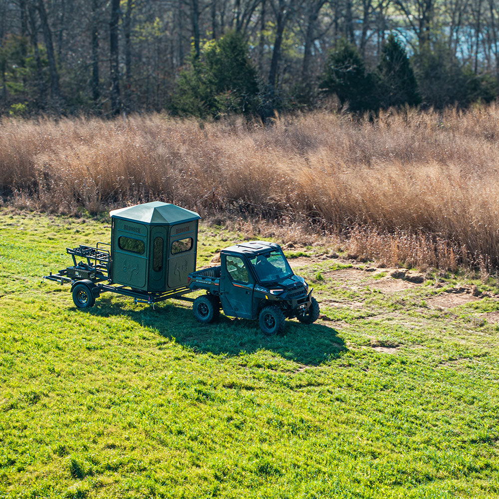 Can-am towing a Redneck Blind using the Hydraulic Trailer.