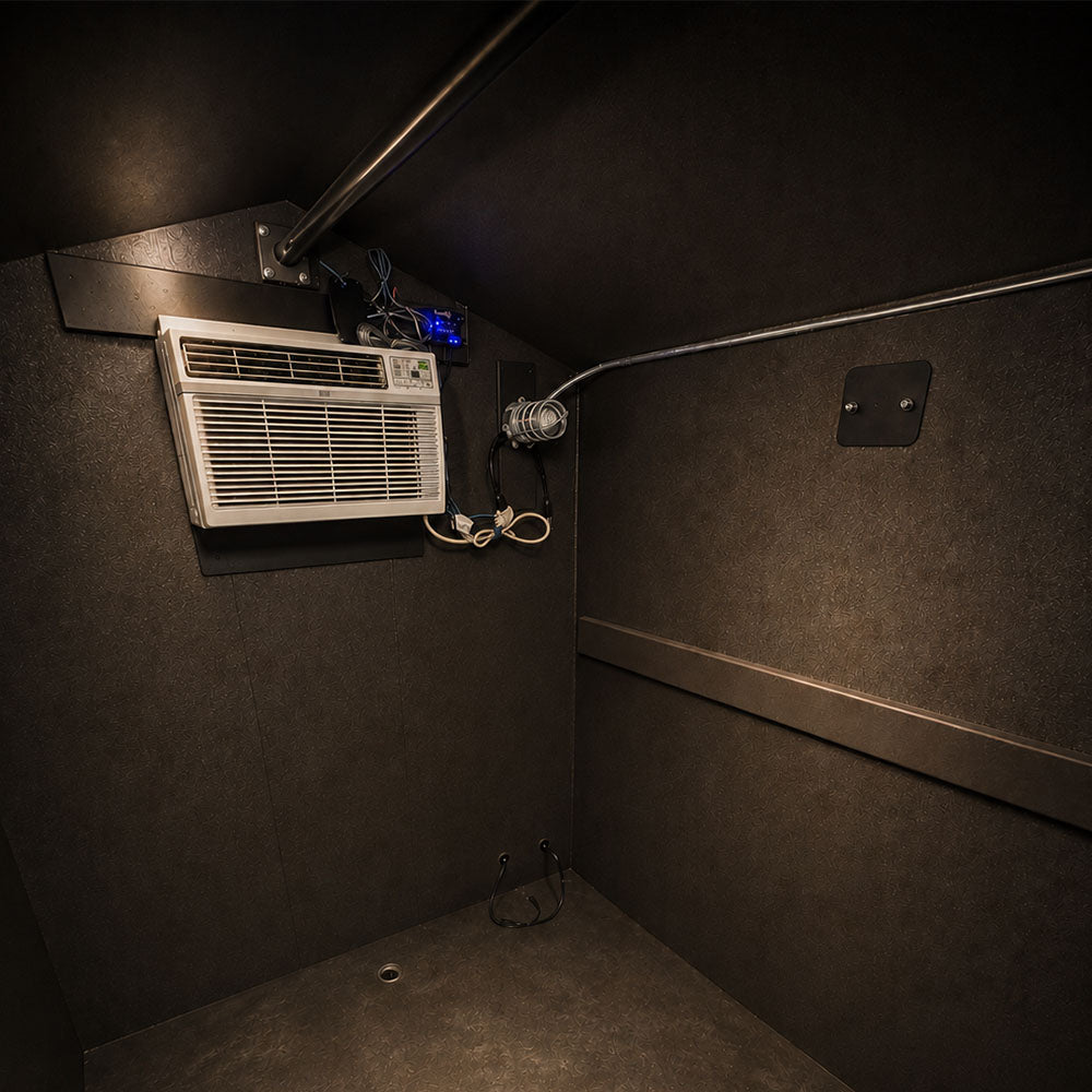 Freedom Walk-in Cooler interior showing AC unit, Coolbot Pro controller, deer hanging rod, light, and drain plug for cleaning.